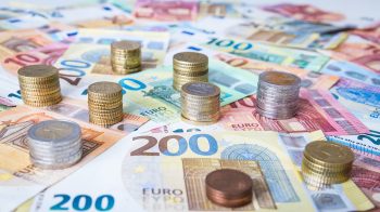 A combination of different Euro banknotes and Euro coins as a closeup